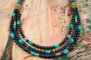 Stunning Necklace featuring Genuine Blue Lapis with Genuine Turquoise Accents. Sterling Silver and Gold Filled Barrels. Sterling Silver Beads, Cones and Clasp. Created by Navajo Artist Tommy Singer. Signed by the artist.